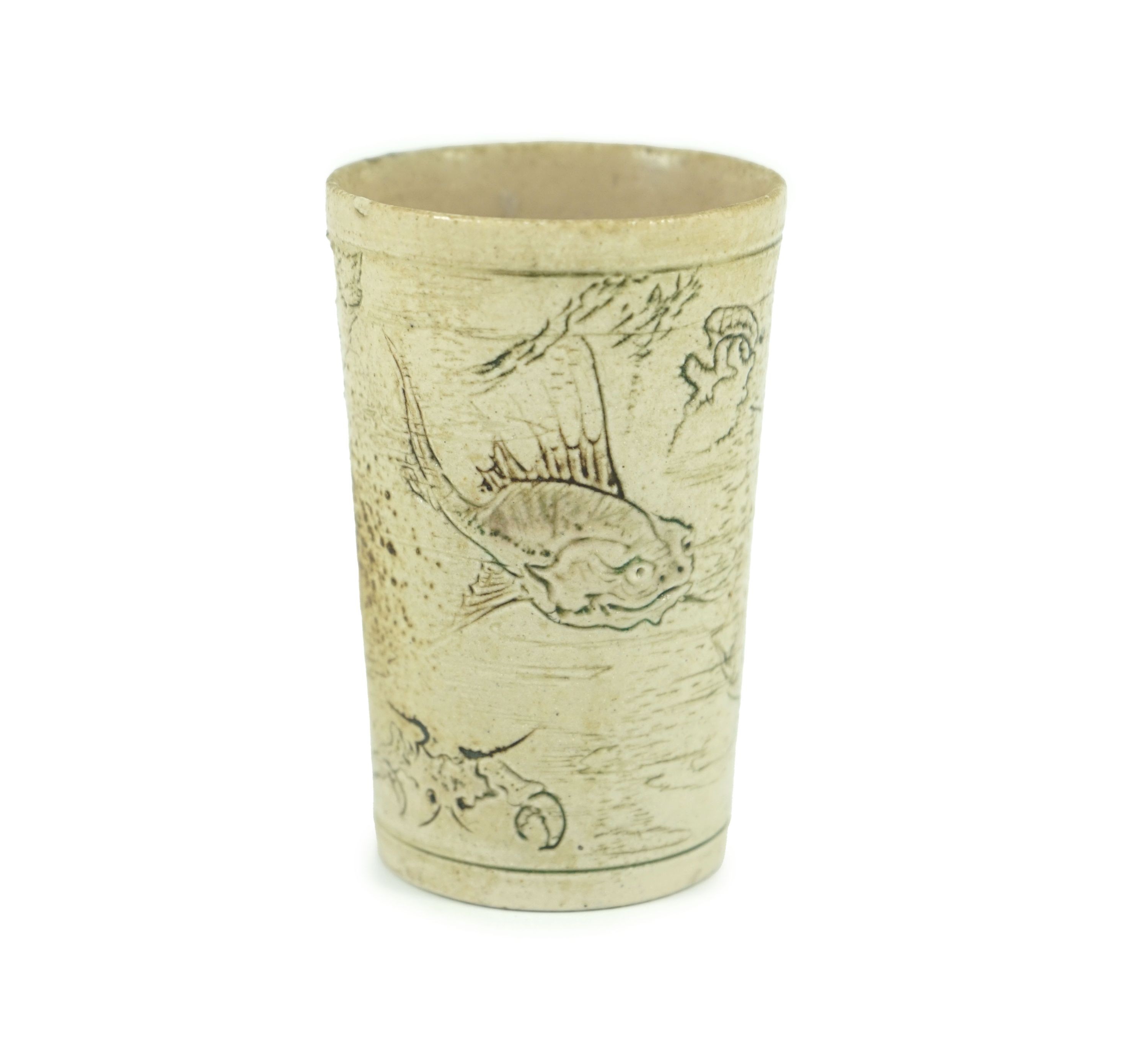 A Martin Brothers ‘grotesque fish’ beaker, dated 1914, 8.7cm high, hairline crack